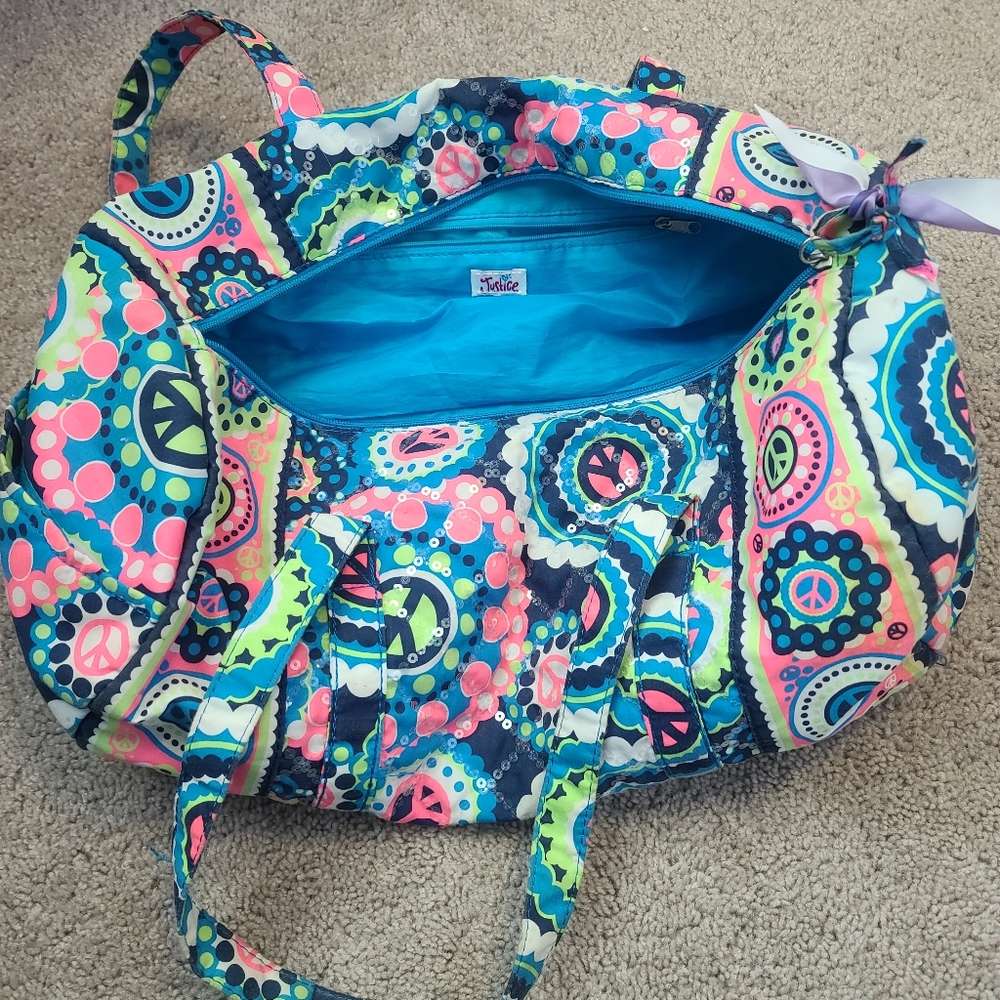 Blue, Pink, and Green Justice duffle bag